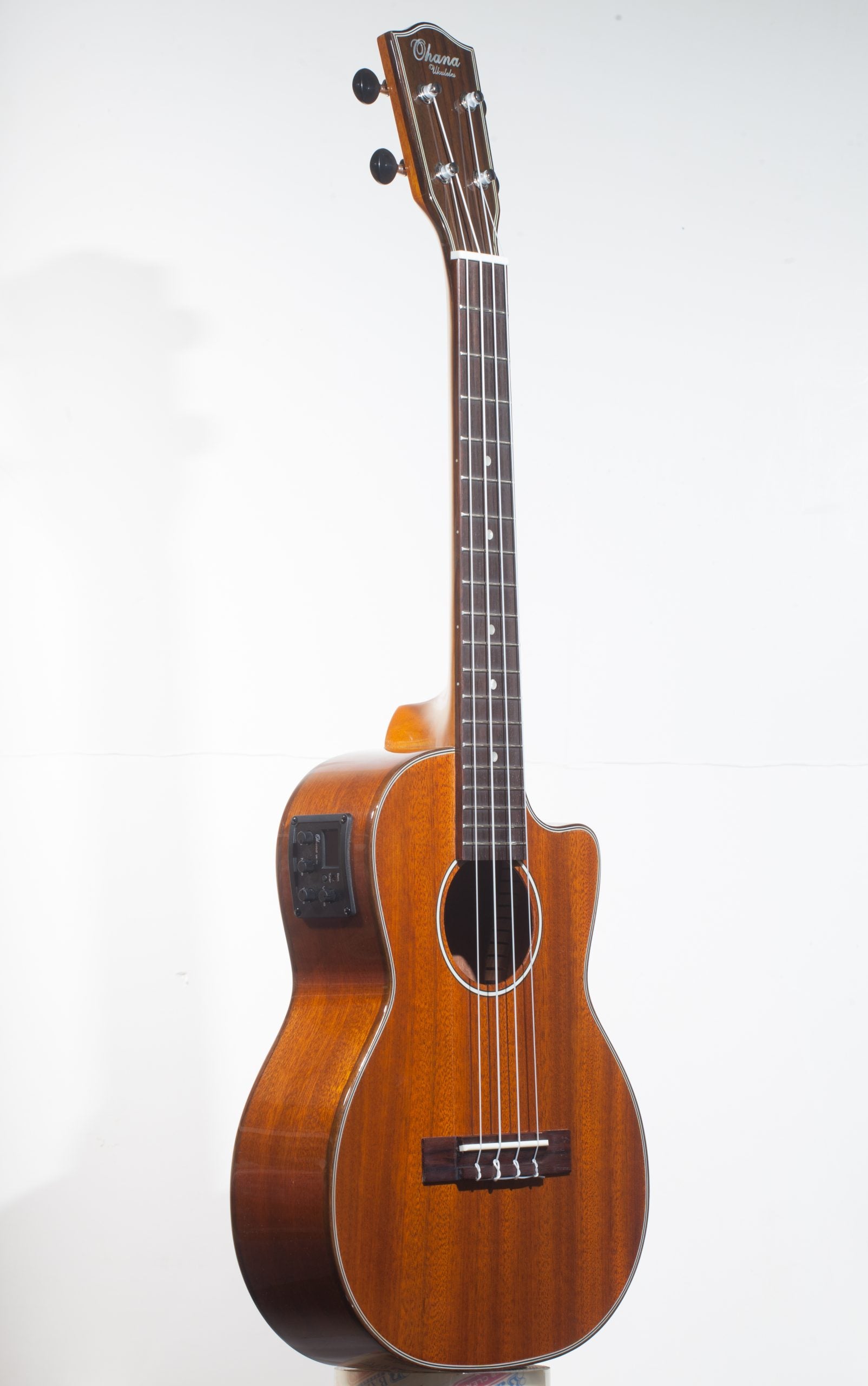 TK-35GCE Tenor Ukulele. Ohana Solid Mahogany Tonewood. Cutaway, Pickup/EQ/Tuner, Ohana Logo Gigbag The tone of mahogany is warm, rich, and mellow. Ohana creates a mahogany Tenor Ukulele with excellent projection and resonance. Truly nice instrument to listen to. Has everything, a mahogany uke of this calibre should have. Ohana constructs their Ukuleles of a light, resonant material. Ukulele Trading Co Australia