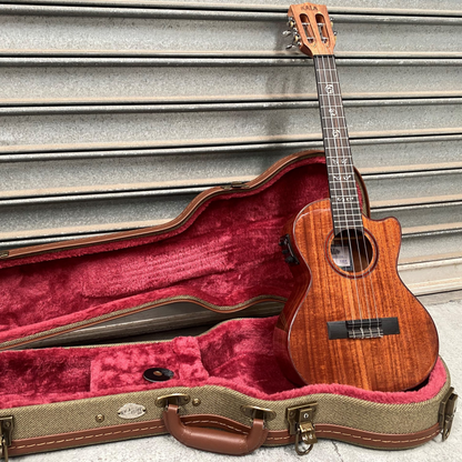 Kala Australian Blackwood Electric Baritone Ukulele with Fishman Kula System, purple heart binding, vintage tuners, and gloss finish for deep, resonant sound and elegant style.